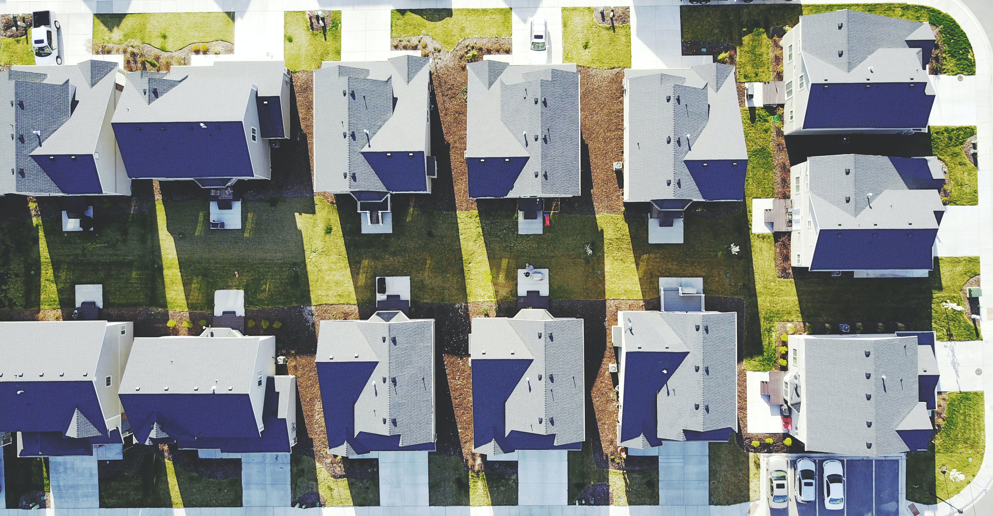 Looking down from the sky on a housing development.